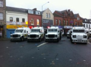 Police landrovers in east Belfast during a stand off with loyalists last December