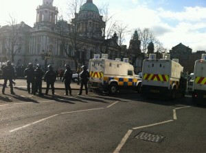 Police in riot gear outside Belfast City Hall on Friday, March 1