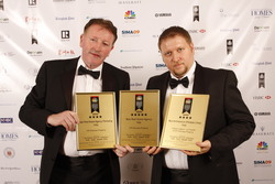 Harry Fitzsimons (left) collecting awards with business partner Antonio Valente