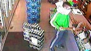 Pink pillow case robber Michael Cassidy robs an off licence with a baseball bat