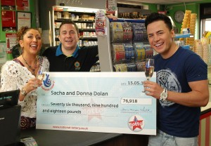 Ryan Dolan (right), brother Sacha (left) with his winning £76,000 Lotto cheque