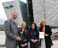 Tim Husbands with visitor experience staff Emma Roddy and Rachael Duncan, and Titanic Belfast Deputy CEO Judith Owens (far right)   
