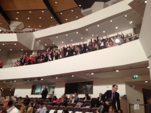 Guests in the Waterfront Hall do a Mexican Wave