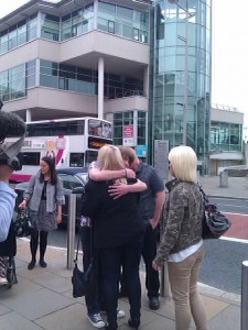 Mary Meehan comforted by family relatives outside Belfast Crown Court on Friday morning