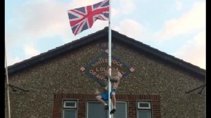 A man captured on video climbing up flag pole at Whiterock Orange Hall