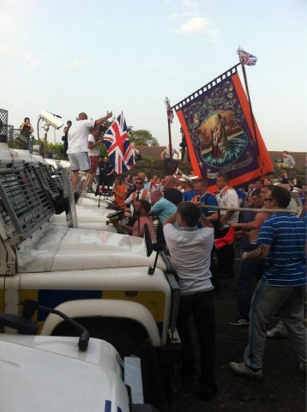 Loyalists attack PSNI landrovers which blocked their return route home on the Twelfth of July