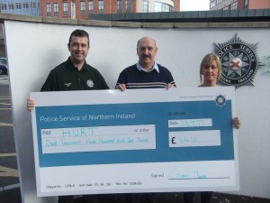 Crime Team cheque presentation Constable Daryl Watton (left), PSNI Crime Team, presenting a cheque for £1,410 to Dessie Kyle, HURT centre manager, and Pauline McCloskey, HURT finance manager.