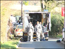 Army technical officers recover pipe bombs and ammunition during searches in Newry