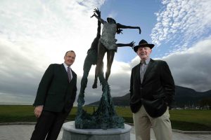 Howard Hastings (left) is pictured with renowned sculptor Paddy Campbell, beside his creation Wind and Sea at the Slieve Donard Resort and Spa.