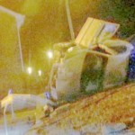 Three police officers miraculously escaped injury when their car crashed