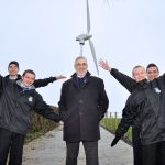 Philip Rainey, Simple Power (centre) is pictured alongside Nathan Garland-O’Neill, David Curran, Ryan Hanna and Mark Quigley from Corpus Christi College, as they visited the company’s single wind turbine at Jim McCord’s farm
