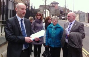 DCI Mark McClarence with the family of Phillipa Reynolds outside court 