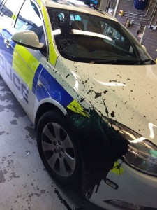 The damaged caused to the police vehicle after it was attacked by masked men