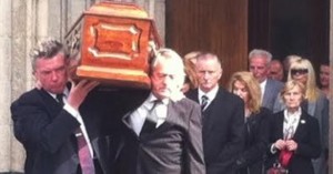 Pals Mickey Bradley and Sean Coyle carry the coffin of Gerry Anderson out of St Eugene's Cathedral today