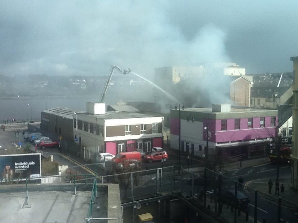 Fire crews on an aerial platform tackling the blaze at the Mandarin Palace Chinese restaurant