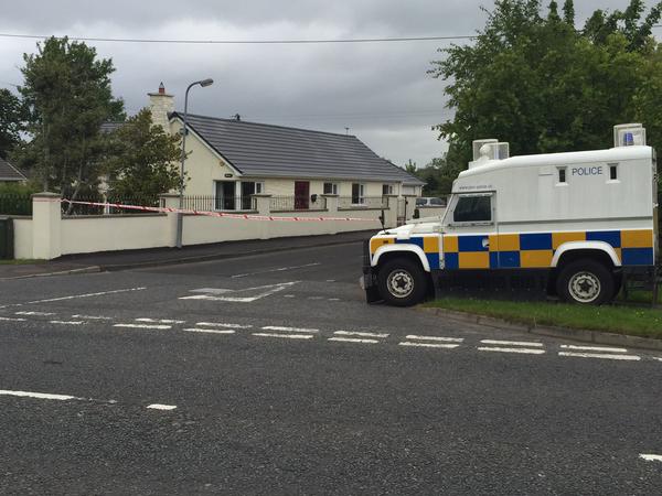 The scene this morning where police found a bomb under a PSNI officer's car in Eglinton