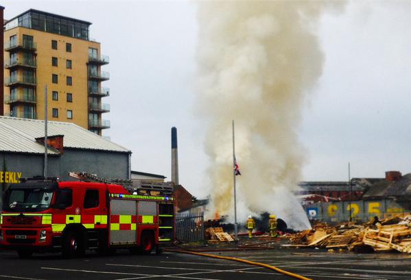 The scene this morning as a bonfire in Sandy Row is set alight