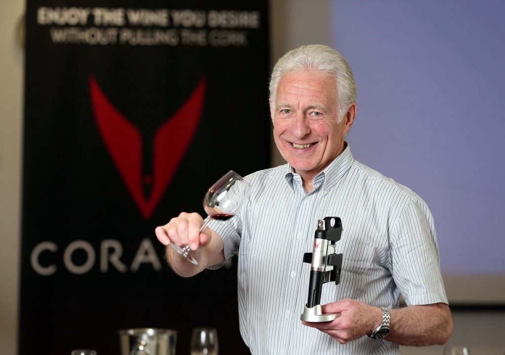 LOCAL COMPANY SEALS DEAL: Denis Broderick from Woodford Bourne NI, a division of Lisburn-based business Robert Roberts (NI), makes a toast to the companys exclusive partnership with U.S. firm Coravin to launch a revolutionary new solution that will transform how wine is enjoyed, served and sold in Northern Ireland. The Coravin System uses technology to extract wine from a corked bottle through a thin hollow needle that is inserted through the cork.  The bottle is pressurized and the wine pours through the needle and into the glass.  Once complete the needle is removed from the cork and the cork reseals, protecting the wine from oxidation, enabling the consumer to enjoy wine by the glass for weeks or months after first accessing it.