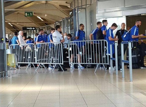 The Northern Ireland team checking into Paris airport ahead of their flight home to Belfast and a heroes welcome at the Fanzzone