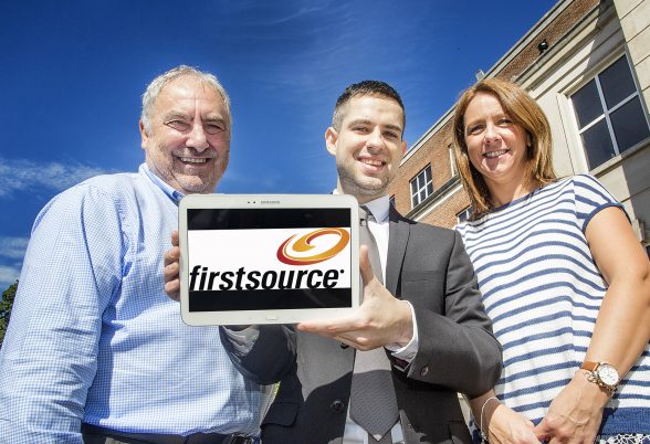 Tim Moruzzi, Ulster University Business School and Programme Director with Firstsource Belfast Employee John McClenaghan, pictured with Fiona Murray, Human Resources , is one of 280 employees worldwide studying for his Contact Centre Management Degree with the company.