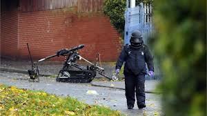 Army bomb experts recover the remains of an exploded pipe bomb in east Belfast