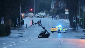 Army bomb experts examine suspect device in south Belfast under policeman