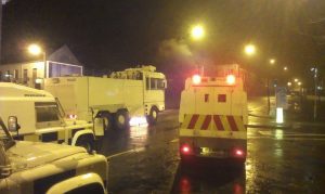 Police and water cannon in Carrickfergus during rioting in December