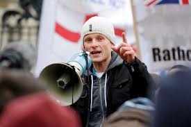 Jamie Bryson convicted over of taking part in unlawful Union flag protests