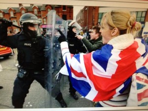 Police draw their batons during trouble outside Seaview in February