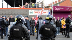 Police charge three protestors at Seaview ground on Saturday