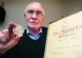 Boxer John McNally with th safe return of his silver Olympic medal