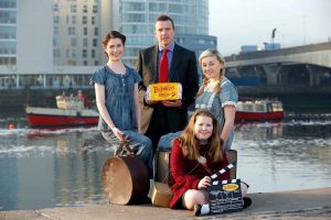 Colin Todd of Brennans Bread with actors Susan Davey and Ruby Campbell and schoolgirl Jessica Potter. 