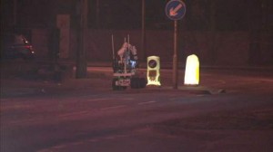 Army bomb disposal robot being used to examine suspicious object left on a bus