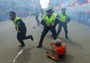 Police at the scene of the bomb blast at finishing line of Boston marathon