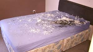 The scorched bed in John Smyth's Antrim home following pipe bomb attack
