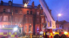 Fire crews pull a man from fire in University Street but he is pronounced dead at the scene