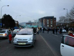 Crowds and cars on the Falls Road in west Belfast on Tuesday night