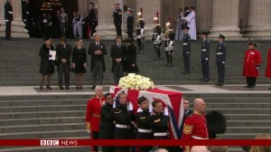 Members of the Armed Forces carry Baroness Thatcher's coffin to a wating hearse