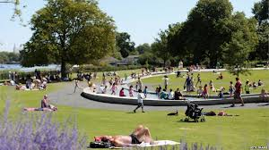 Sun worshippers enjoying the heat rays in Botanic Gardens, Belfast