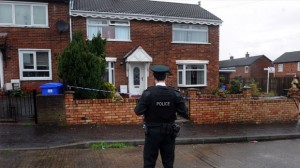 Police guarding the scene at Highpark Cross where the body of Enda Walker was found on Sunday evening