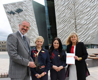 Tim Husbands with visitor experience staff Emma Roddy and Rachael Duncan, and Titanic Belfast Deputy CEO Judith Owens (far right)