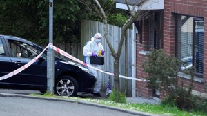 Forensci officer at the scene of shooting in west Belfast on Thursday