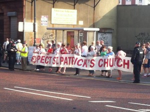 Residents protest outside St Patrick's Church on the Twelfth of July over an Orange Order parade