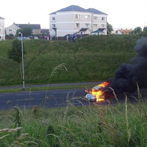 A car on fire on the O'Neill's Road in Glengormley