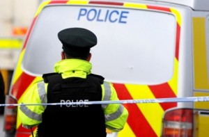 Police cordon off the scene of a double fatal shooting in Glenarm, Co Antrim on Friday evening