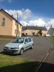A silver Renault Clio which was last month by a rampaging 100-strong mob on the Suffolk estate in west Belfast last month