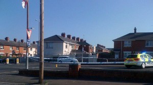 A police cordon is erected at Tates Avenue on Friday morning