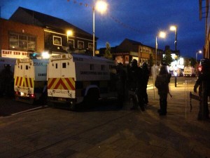 Police in riot gear on the Newtownards Road in east Belfast during sporadic violence