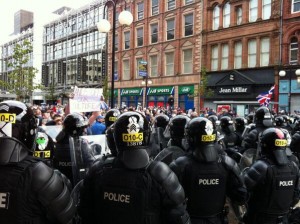 Police hold back loyalists in Royal Avenue