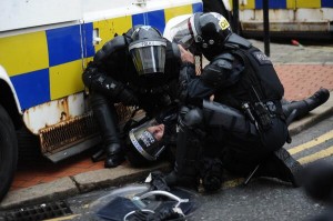 PSNI riot squad officer knocked out after struck by metal missile in Royal Avenue